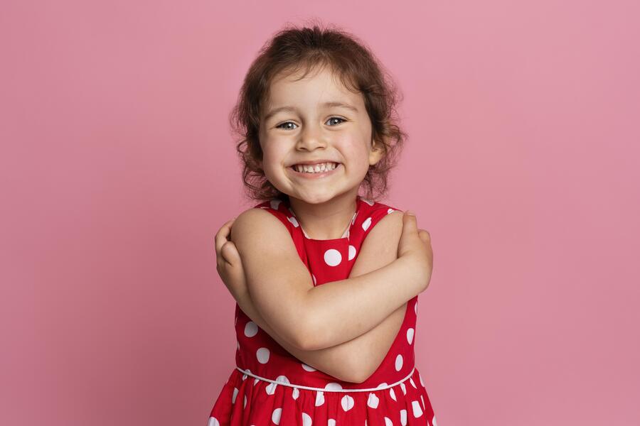 smiley little girl red dress 1
